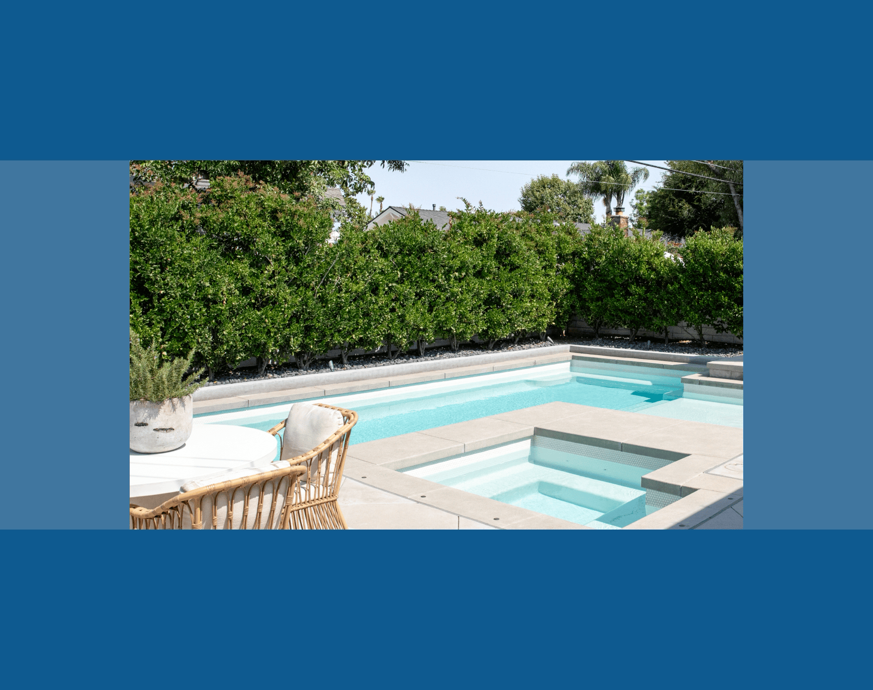 A boy reaching for a ball in a pool