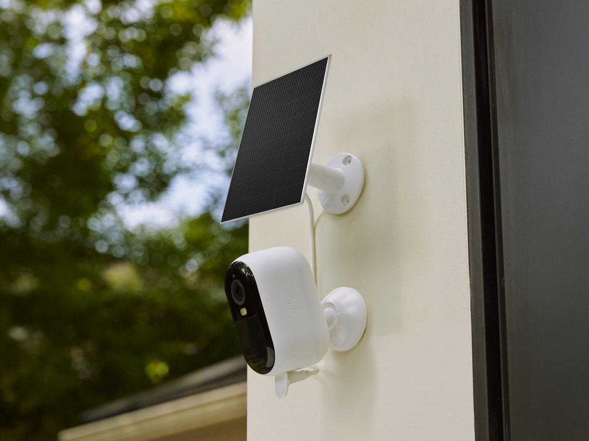 A solar panel charger and camera mounted on a wall