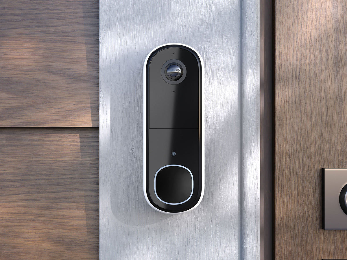 Arlo Video Doorbell mounted next to front door of house