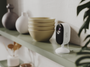 Arlo Essential 3rd Gen Indoor camera on top of a kitchen shelf