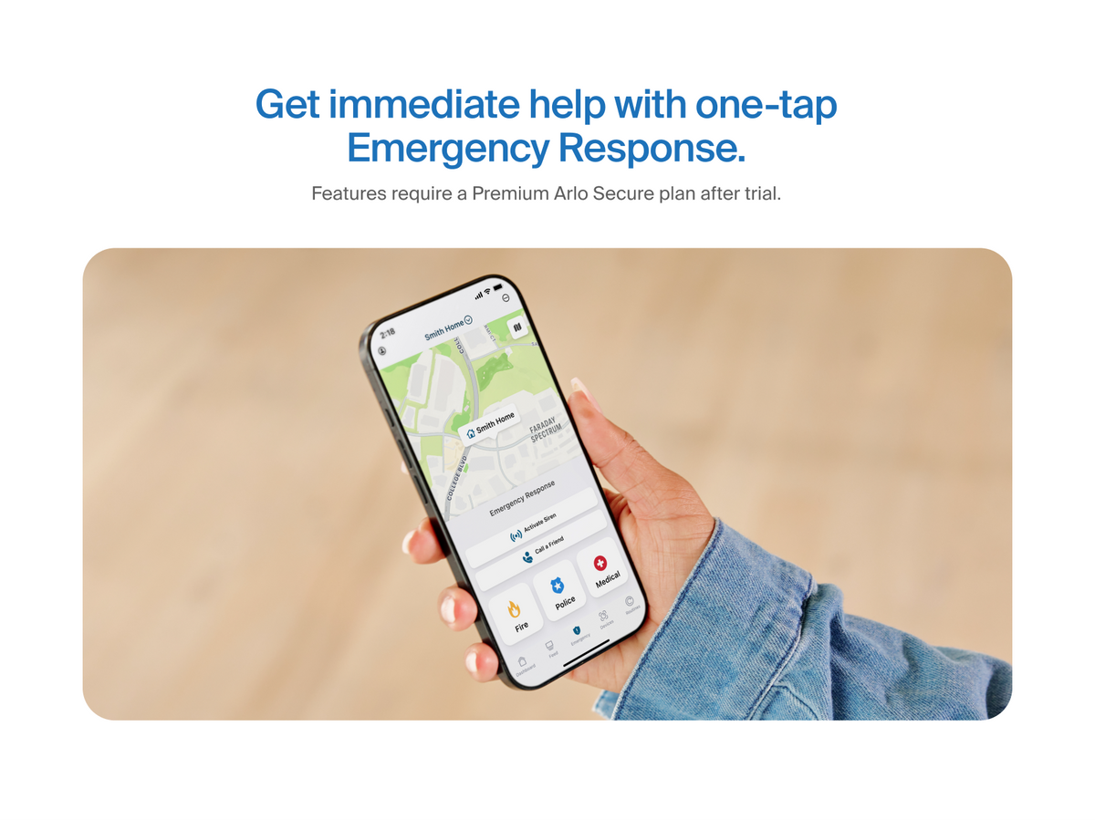A person holding a phone with 24/7 Emergency Response screen