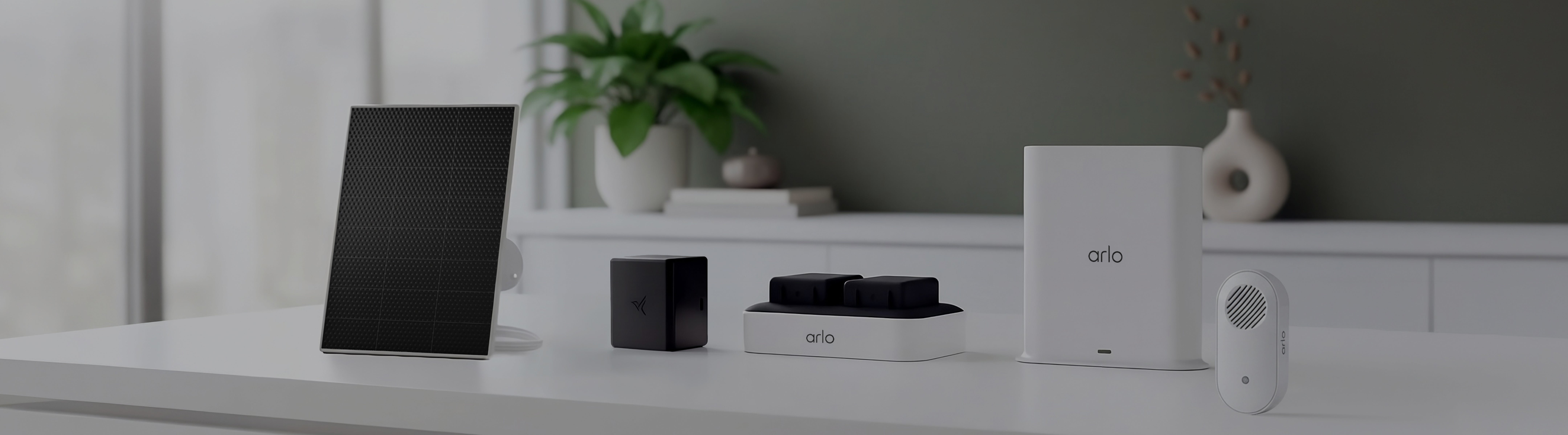 Smart home device setup on a white surface with a neutral background