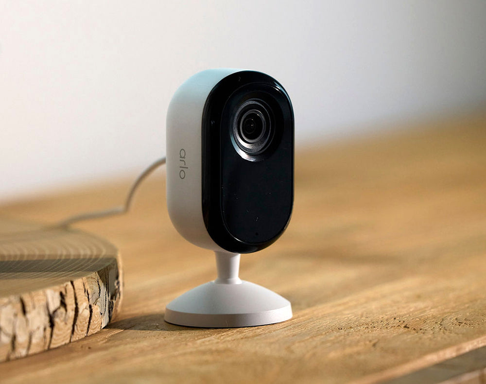 Arlo Essential 3rd Gen Indoor camera on a wooden table