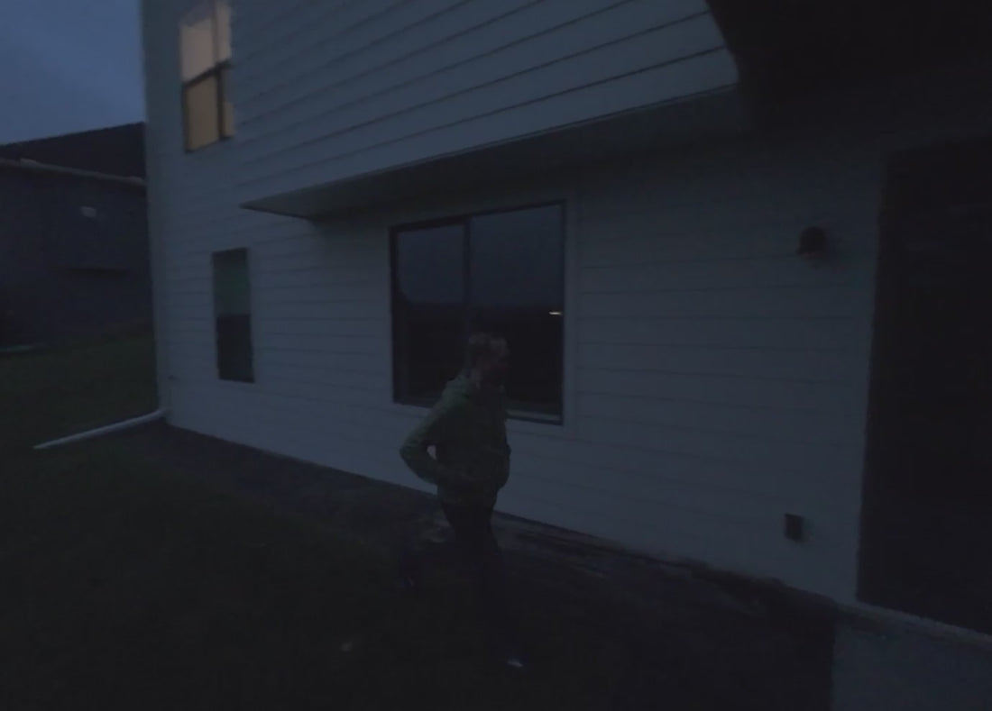 A burglar trying to enter sliding glass door in the backyard and the Arlo Ultra 3rd Gen camera turning the lights on and the burglar running away