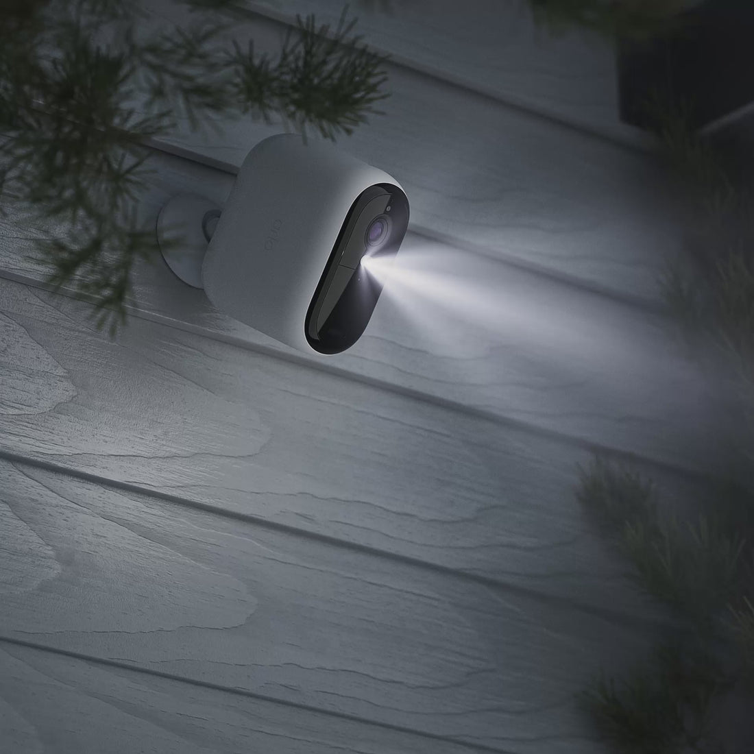 Arlo Essential 3rd Gen XL camera mounted on a side of home at night animation