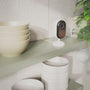 Arlo Essential 3rd Gen Indoor camera on top of a kitchen shelf animation