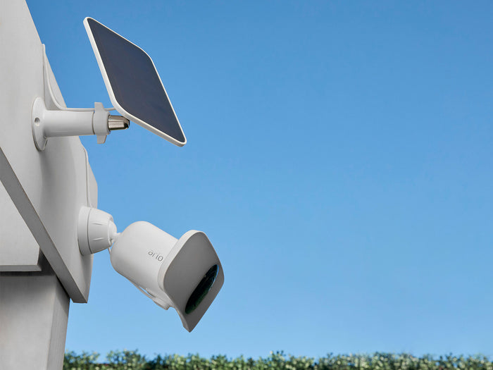 Arlo Wireless Floodlight with solar panel on house